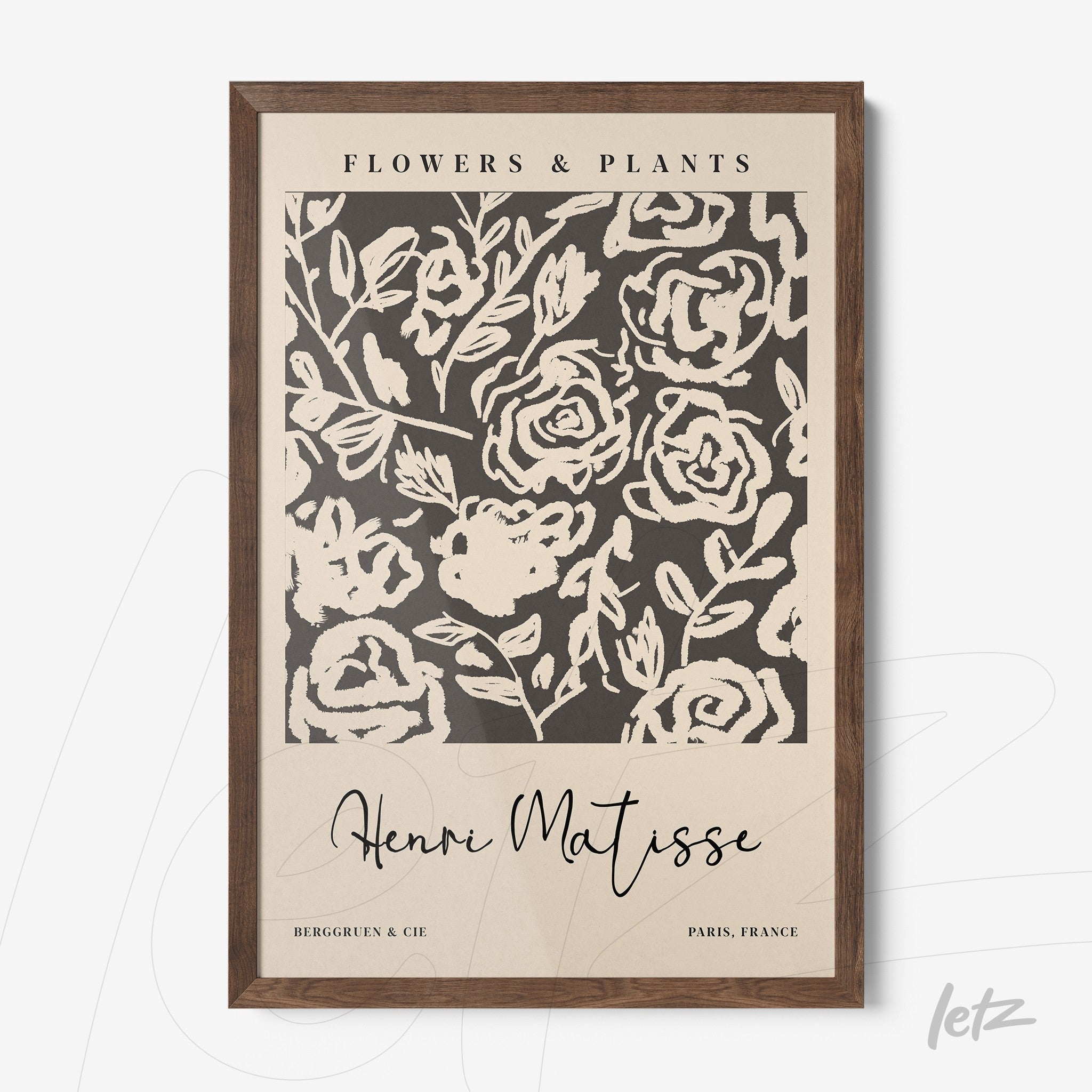 framed artwork featuring botanical inspiration with a light background and dark wood frame