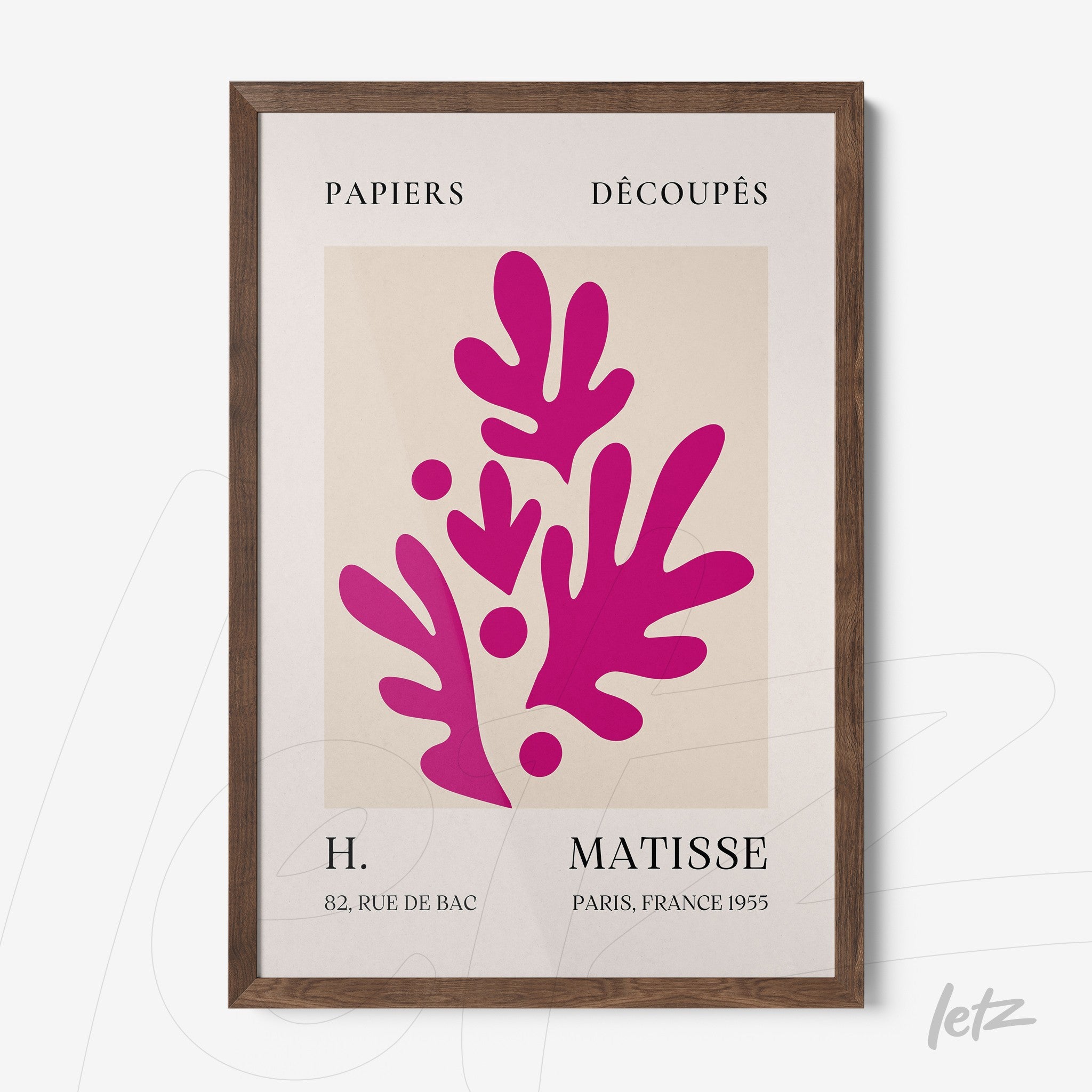 framed wall art featuring colorful cut-out design by H. Matisse with dark wood frame