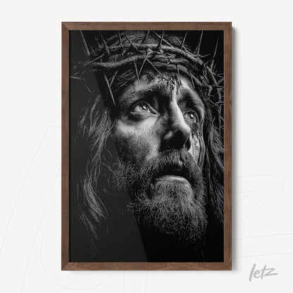 framed black and white portrait of a man wearing a crown of thorns with dark wood frame