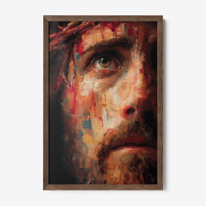 framed artwork depicting an expressive close-up of a man's face with warm tones and dark wooden frame