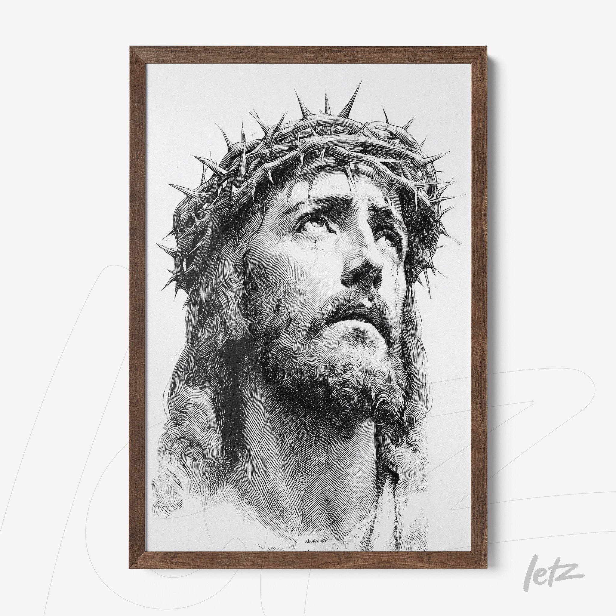 framed artwork featuring a black and white portrait of Jesus Christ wearing a crown of thorns with a dark brown frame