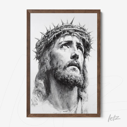 framed artwork featuring a black and white portrait of Jesus Christ wearing a crown of thorns with a dark brown frame