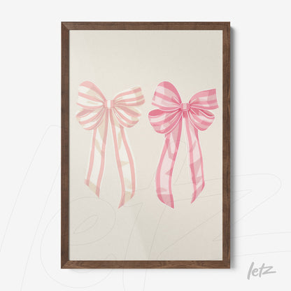 framed art featuring pink bows with ribbons on a light background