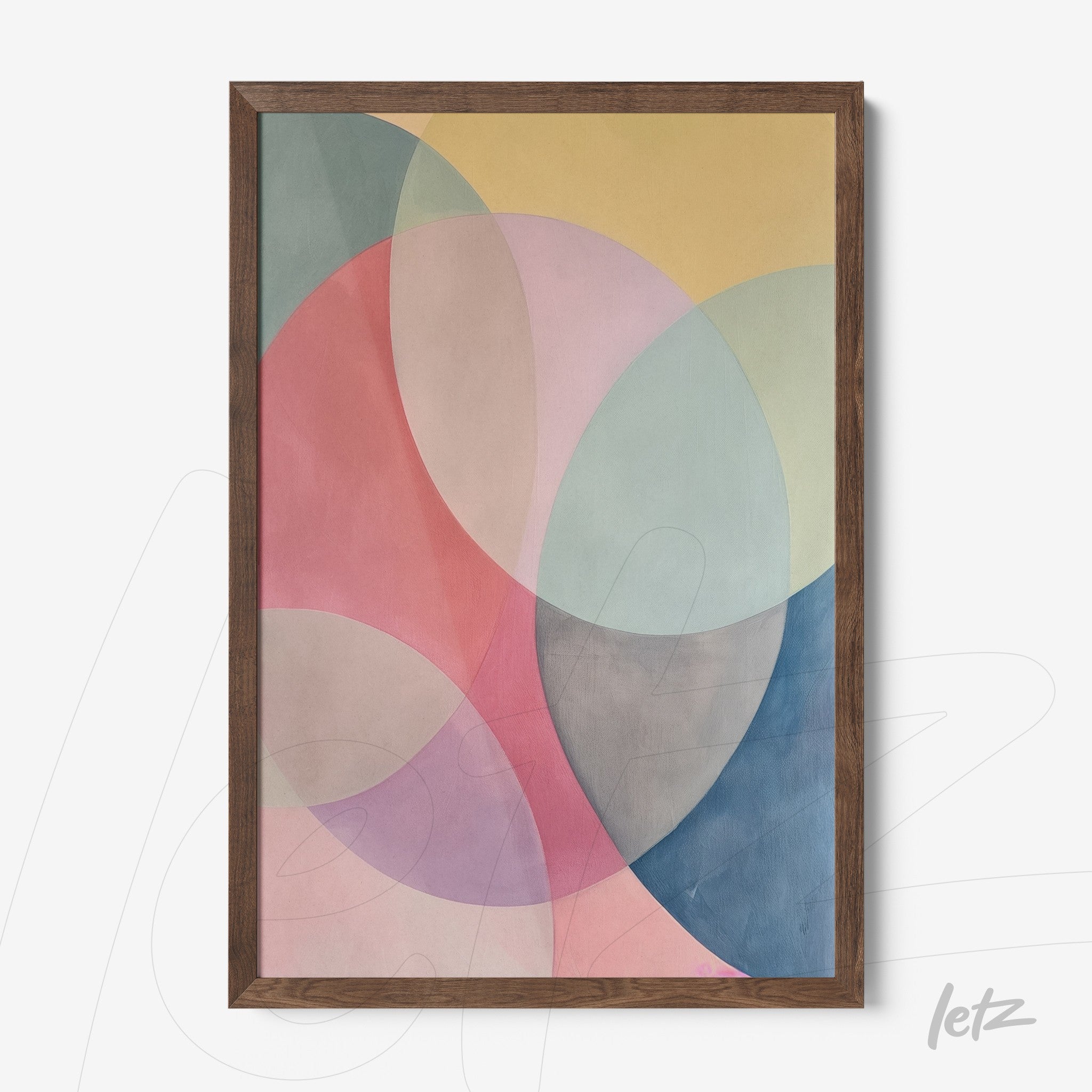 framed abstract art with soft shades of pink, blue, and yellow featuring a dark wood frame