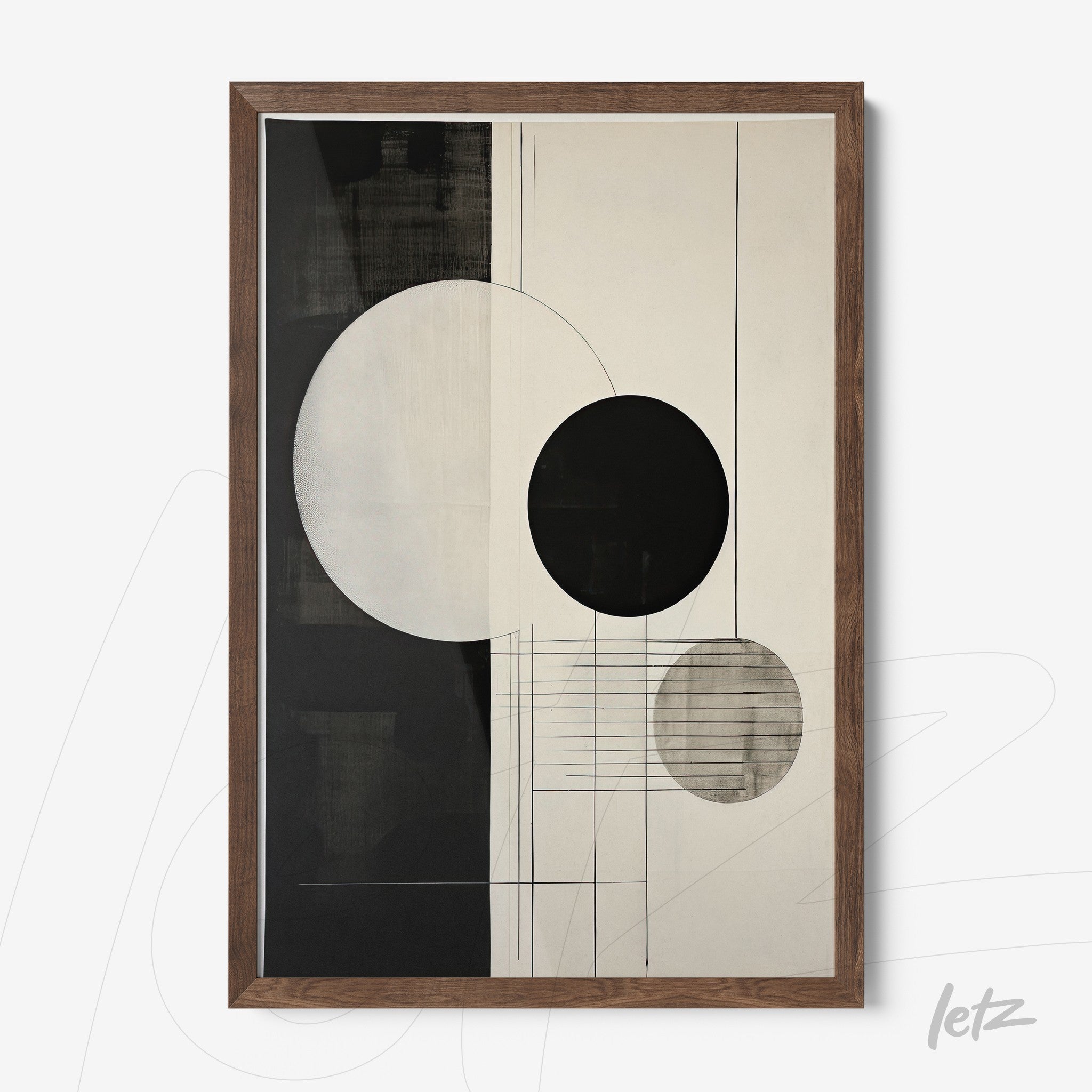 abstract wall art in black and white featuring circular shapes in a dark wooden frame