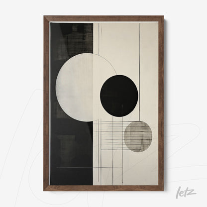 abstract wall art in black and white featuring circular shapes in a dark wooden frame