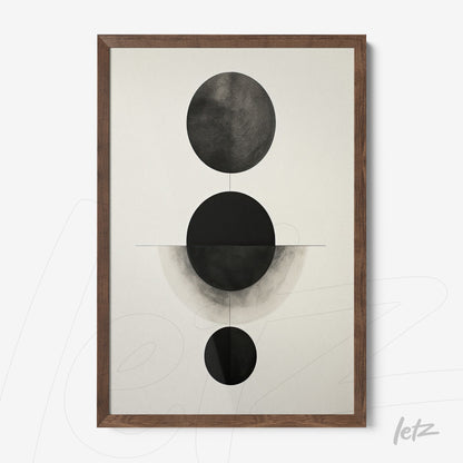 abstract wall art featuring black and white circular shapes highlighted, framed in dark wood