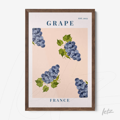 framed wall art featuring illustrations of grape clusters on pink background with dark wood frame