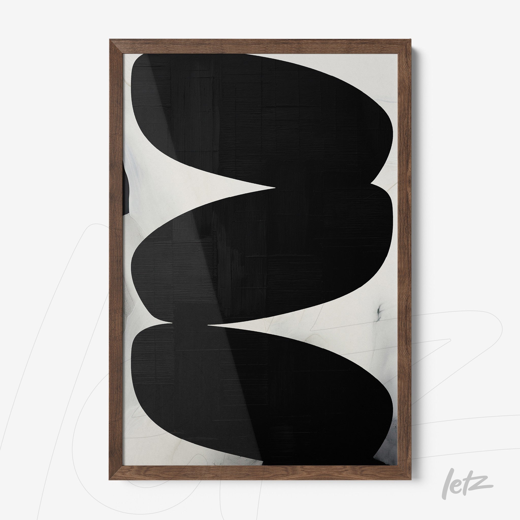 framed wall art featuring abstract black and white design with light wooden frame