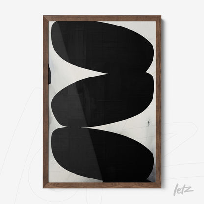 framed wall art featuring abstract black and white design with light wooden frame