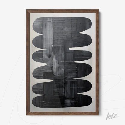 abstract wall art in black and gray tones featuring rounded shapes with a light wood frame