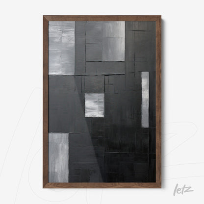 modern abstract wall art in black, gray, and white with geometric texture in dark wooden frame