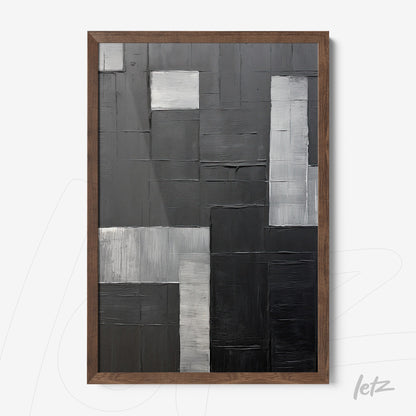 abstract wall art in shades of gray featuring textures on a geometric background, framed in dark wood