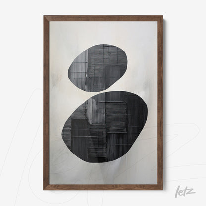 abstract wall art in black and white with light wood frame featuring oval shapes
