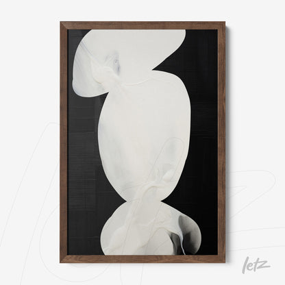 framed abstract art in light tones against a black background with a dark wood frame