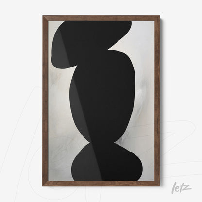 abstract wall art in black over soft light-colored background with dark wooden frame