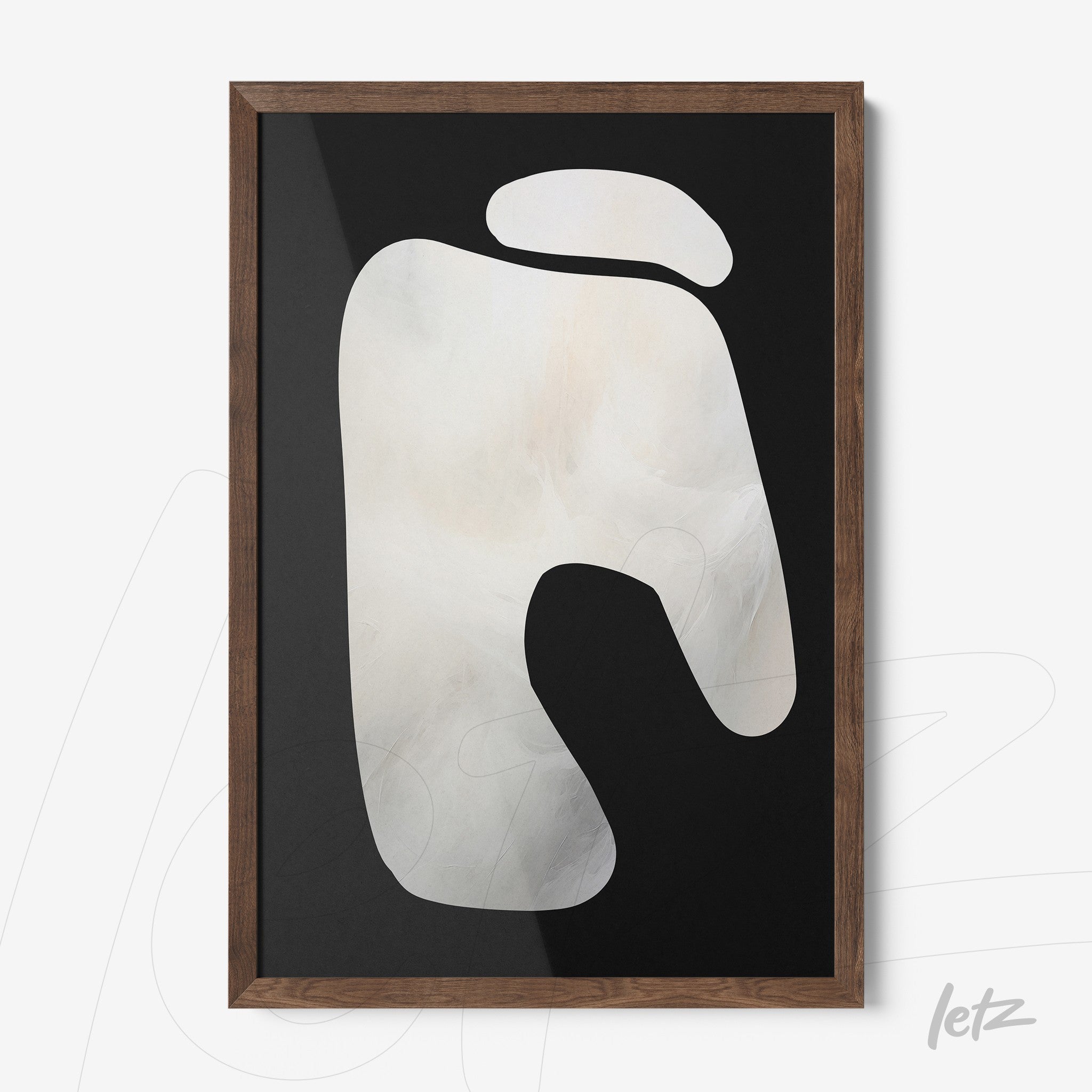framed wall art with abstract light tones on dark background and dark wood frame