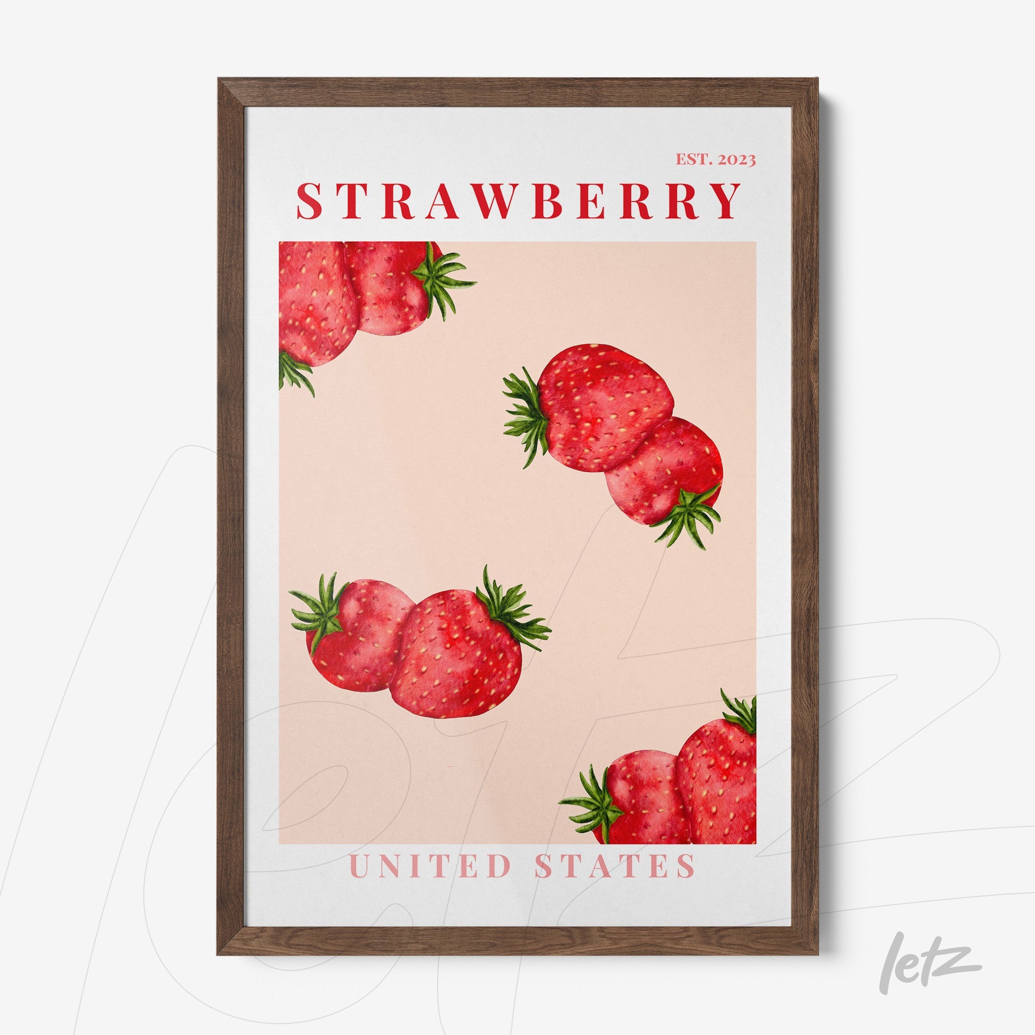 framed wall art featuring stylized strawberries on a light pink background with dark wood frame