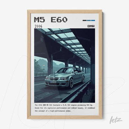 light framed artwork featuring pixel art of a BMW M5 E60 on a covered road, with details of the year 2006 and informative text at the bottom