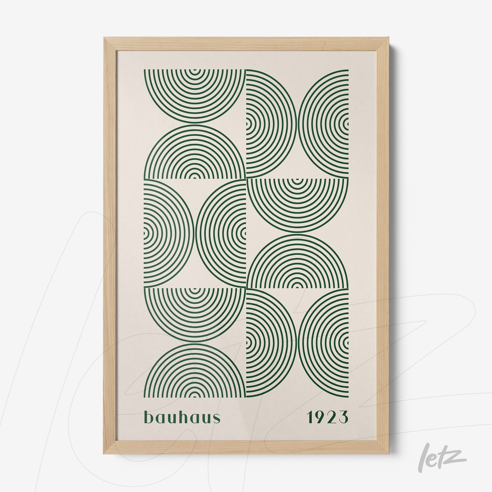 poster print featuring green concentric circles in bauhaus style with light wood frame
