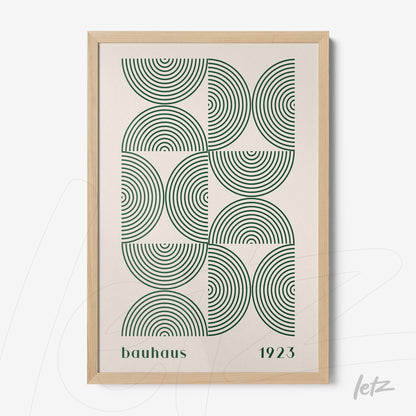 poster print featuring green concentric circles in bauhaus style with light wood frame
