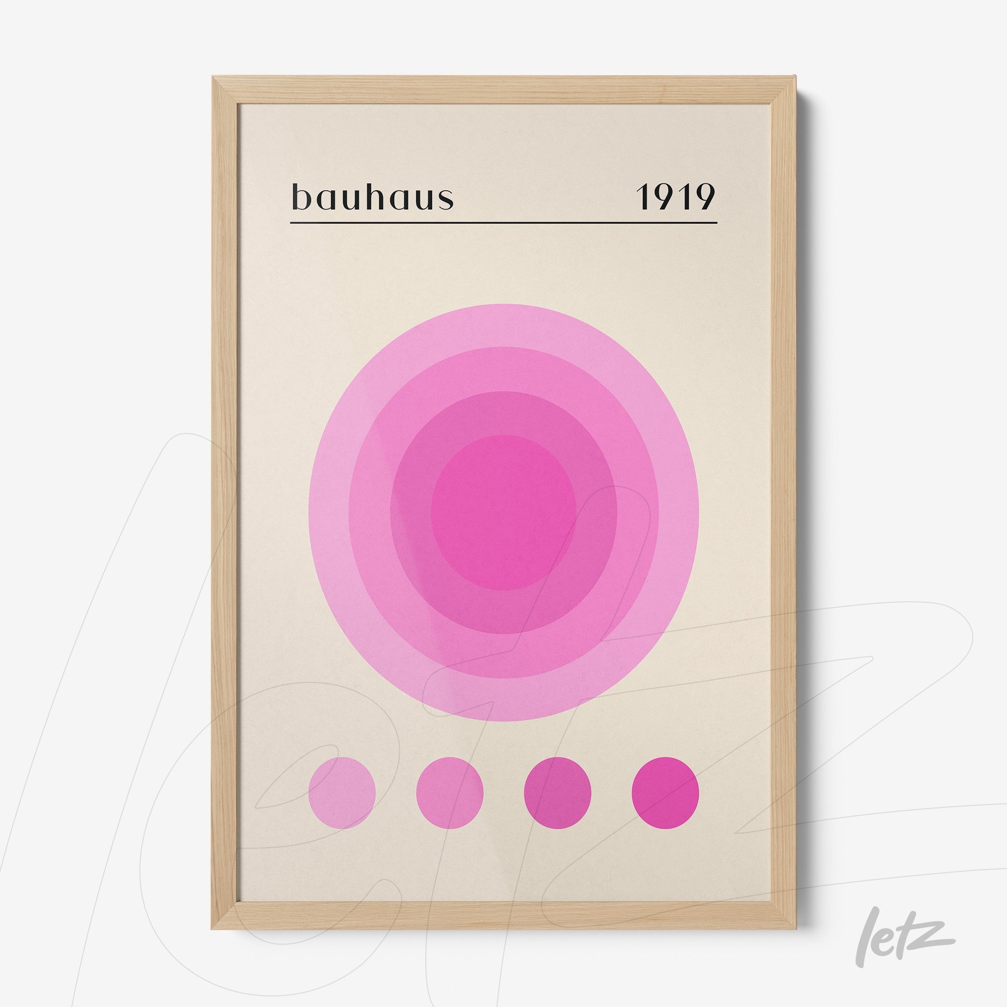 poster print featuring geometric art in shades of pink with a light wood frame