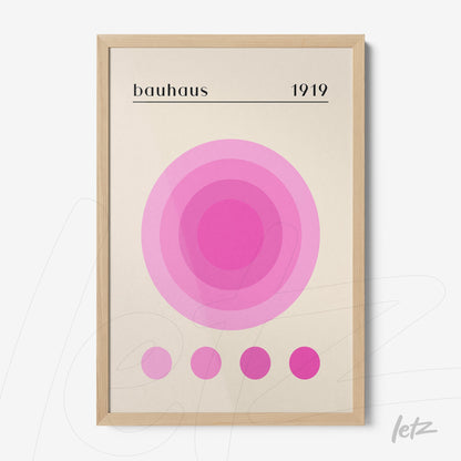 poster print featuring geometric art in shades of pink with a light wood frame