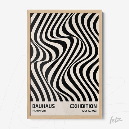 poster with black and white abstract design in light wood frame