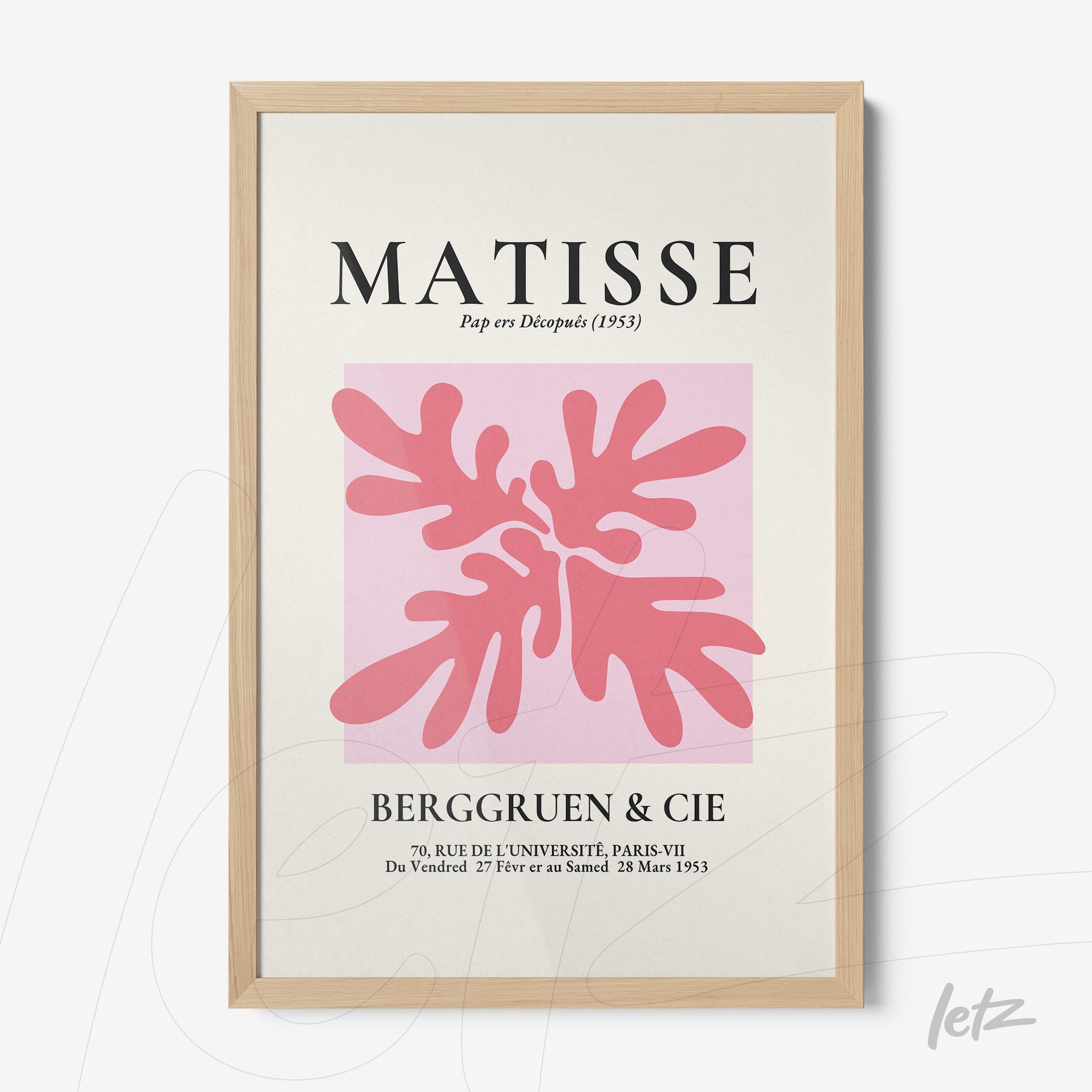 framed modern artwork featuring light pink foliage on a pink background with decorative text and light wood frame