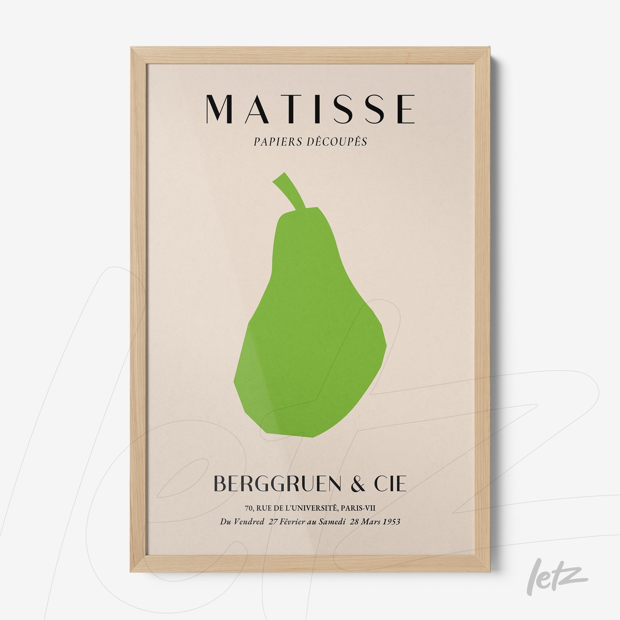 framed modern art piece featuring a green pear with French text, set in a light wood frame