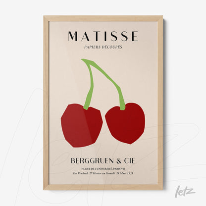 framed artwork featuring abstract red fruits in light wooden frame