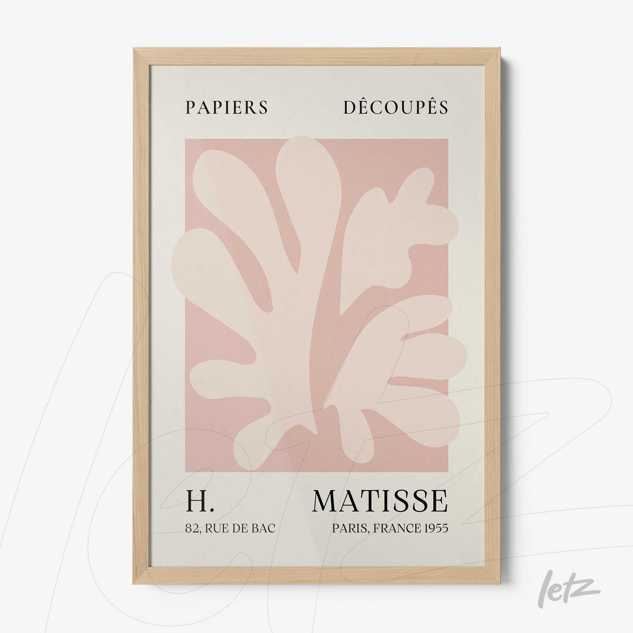 framed wall art featuring modern design with organic shapes in soft tones on light pink background with light wood frame