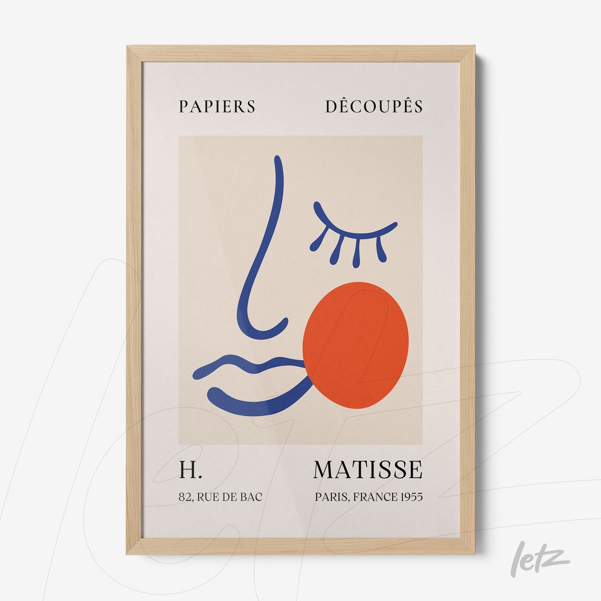 framed modern art inspired by Henri Matisse, featuring an abstract face outlined in blue with a red circle and graphic details, in a light wood frame