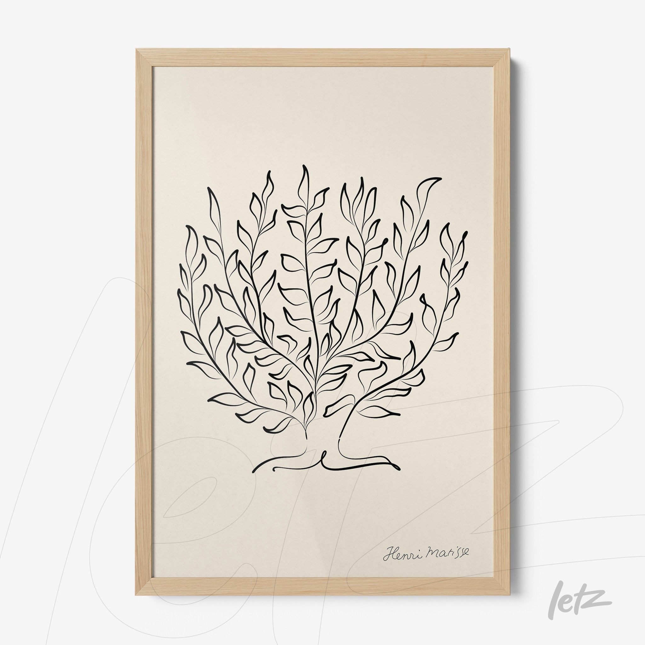 framed artwork featuring a minimalistic black line illustration of leaves on a cream background with a light wood frame