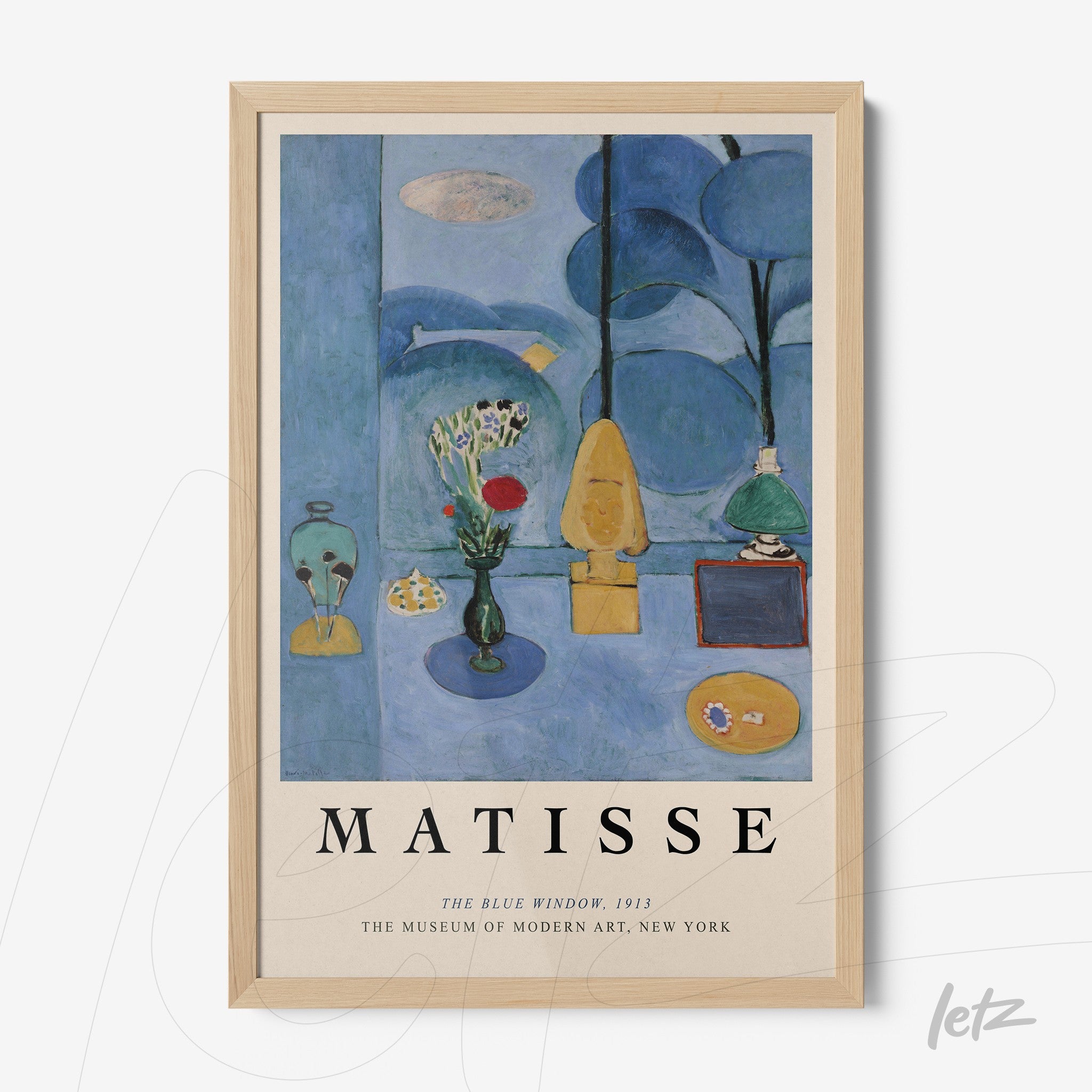 framed art piece by Henri Matisse titled 'The Blue Window' in light wood frame