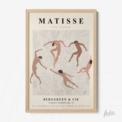 framed wall art featuring stylized dancing figures on a light background with a light wood frame