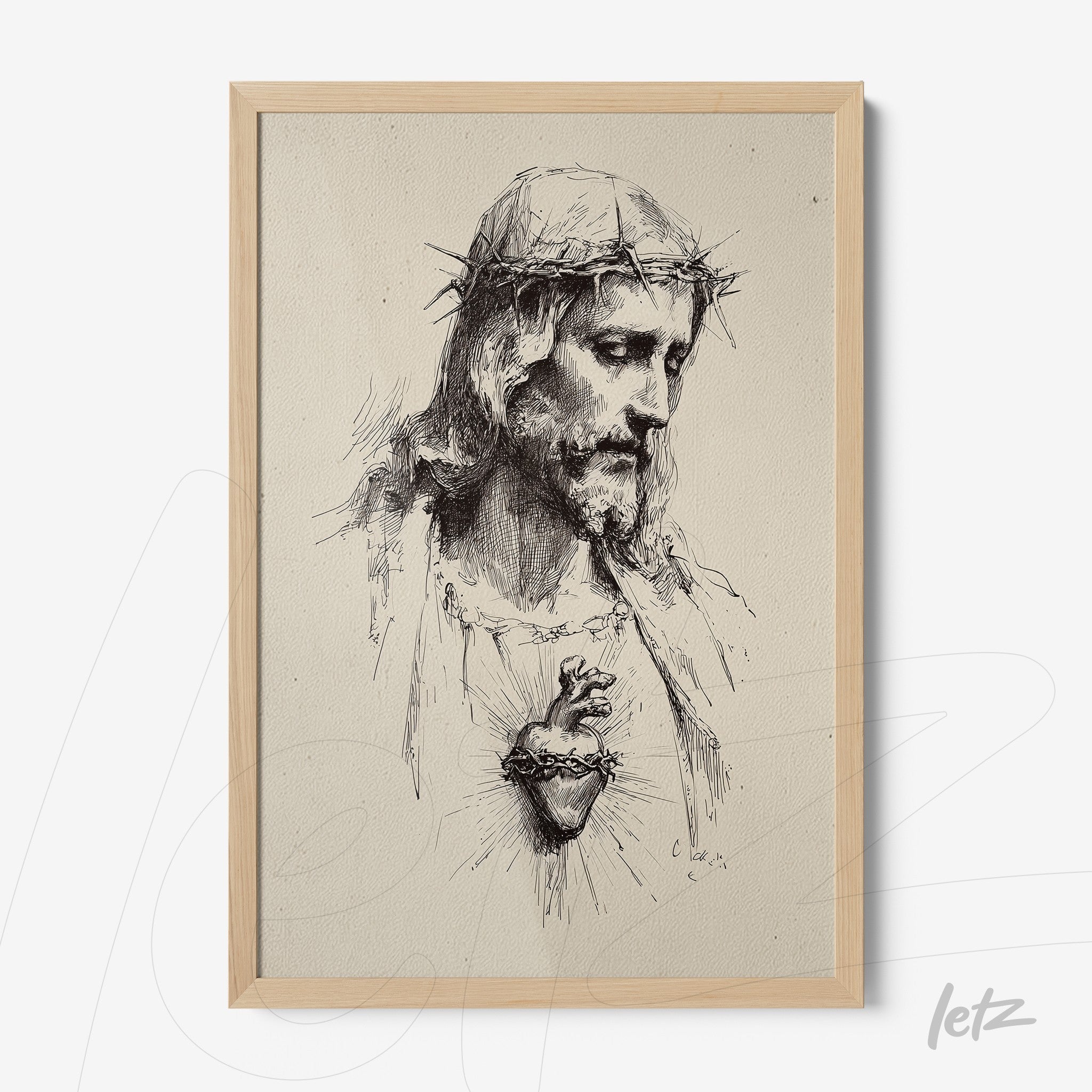 framed artwork with light wood border featuring a black and white drawing of Jesus Christ with a crown of thorns and sacred heart