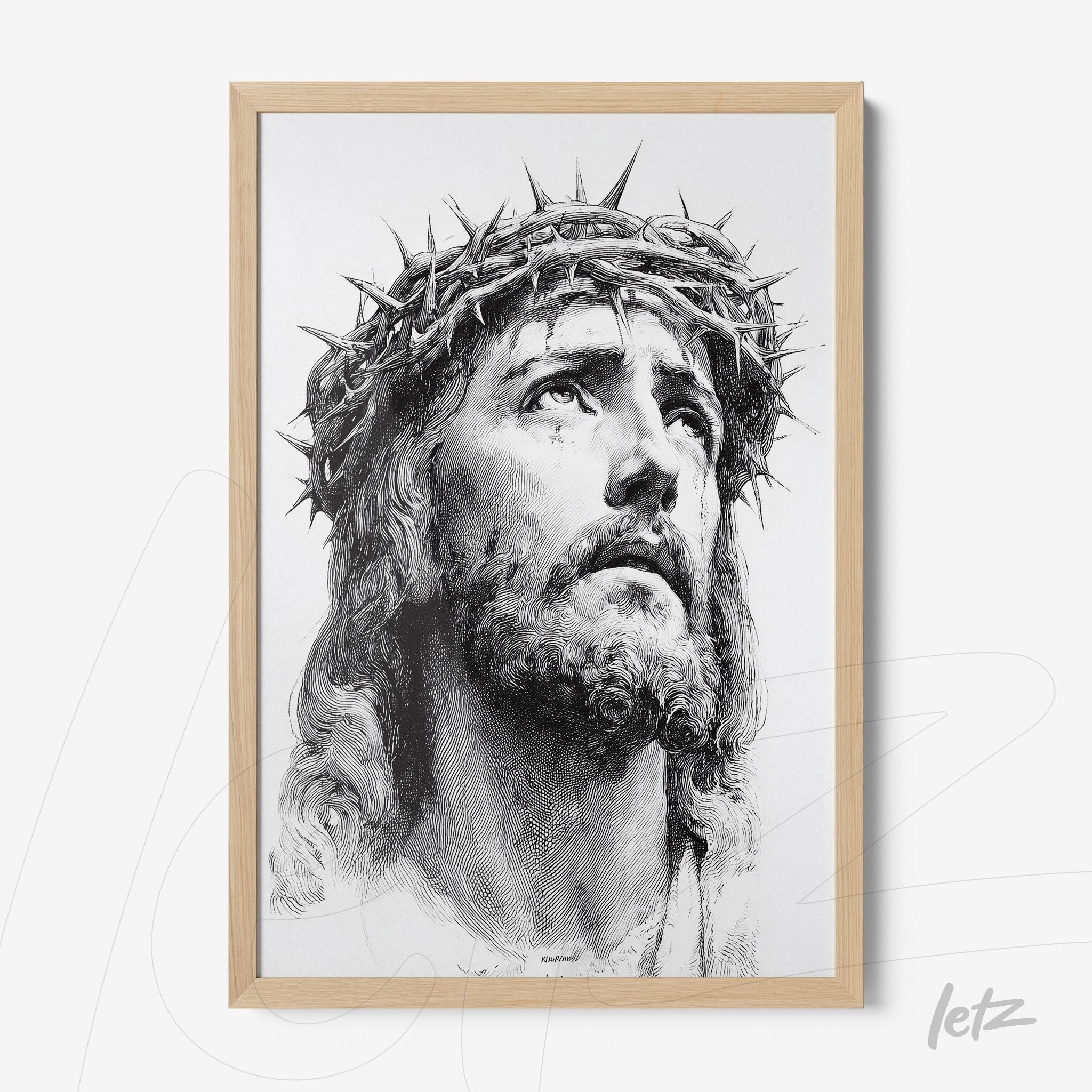 framed portrait of jesus christ wearing a crown of thorns with light wooden frame