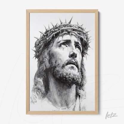 framed portrait of jesus christ wearing a crown of thorns with light wooden frame
