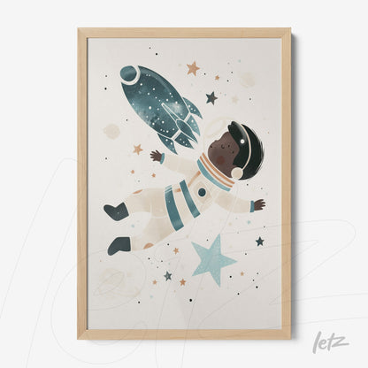 framed children's illustration of an astronaut floating in space with a rocket and stars in a light wood frame