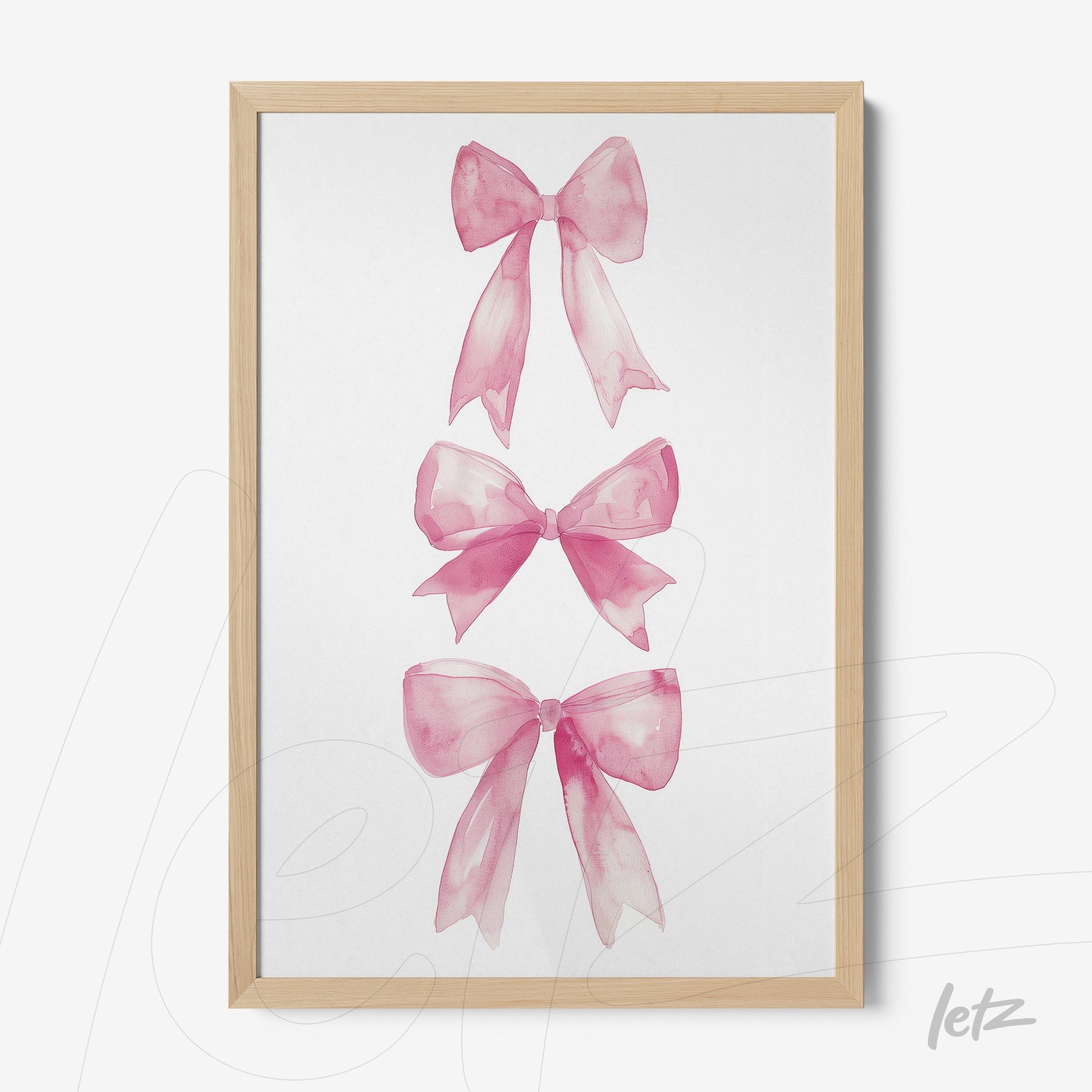 framed wall art featuring three watercolor pink bows with light wood frame