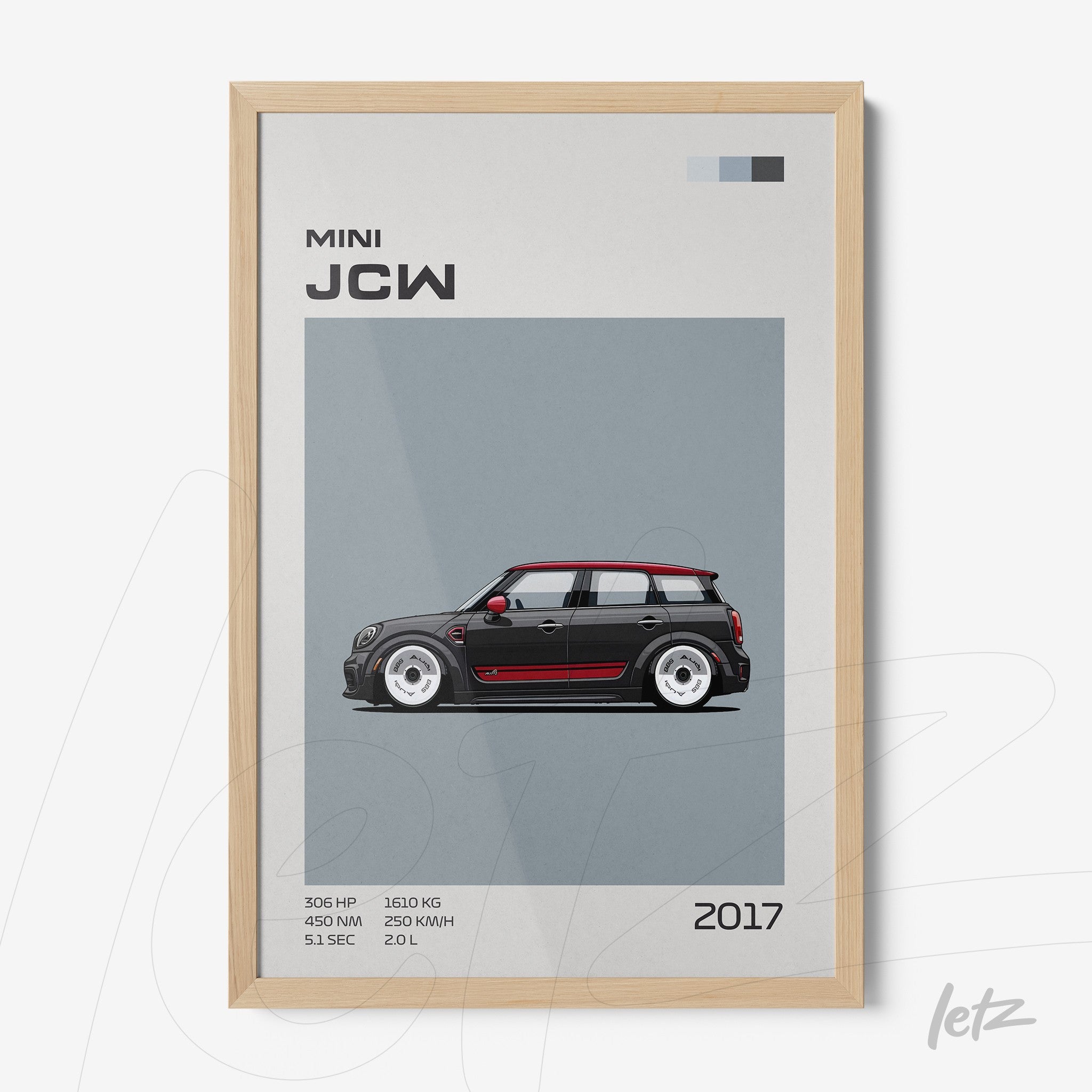 framed artwork of the 2017 Mini JCW car in light wood frame featuring a gray background and graphic details