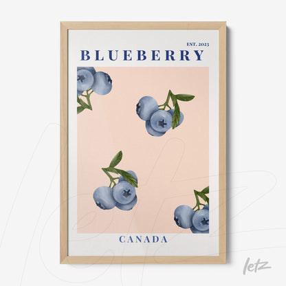 framed art piece featuring blueberries on a pink background with a light wood frame