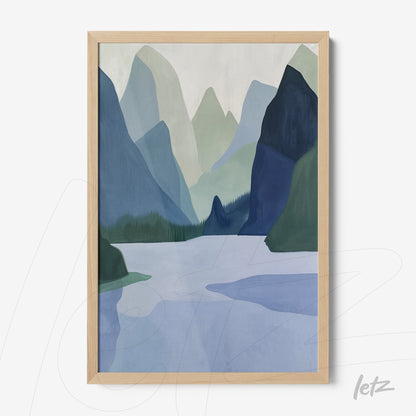 framed wall art featuring abstract landscape in shades of blue and green depicting mountains with a lake and trees in a light wood frame
