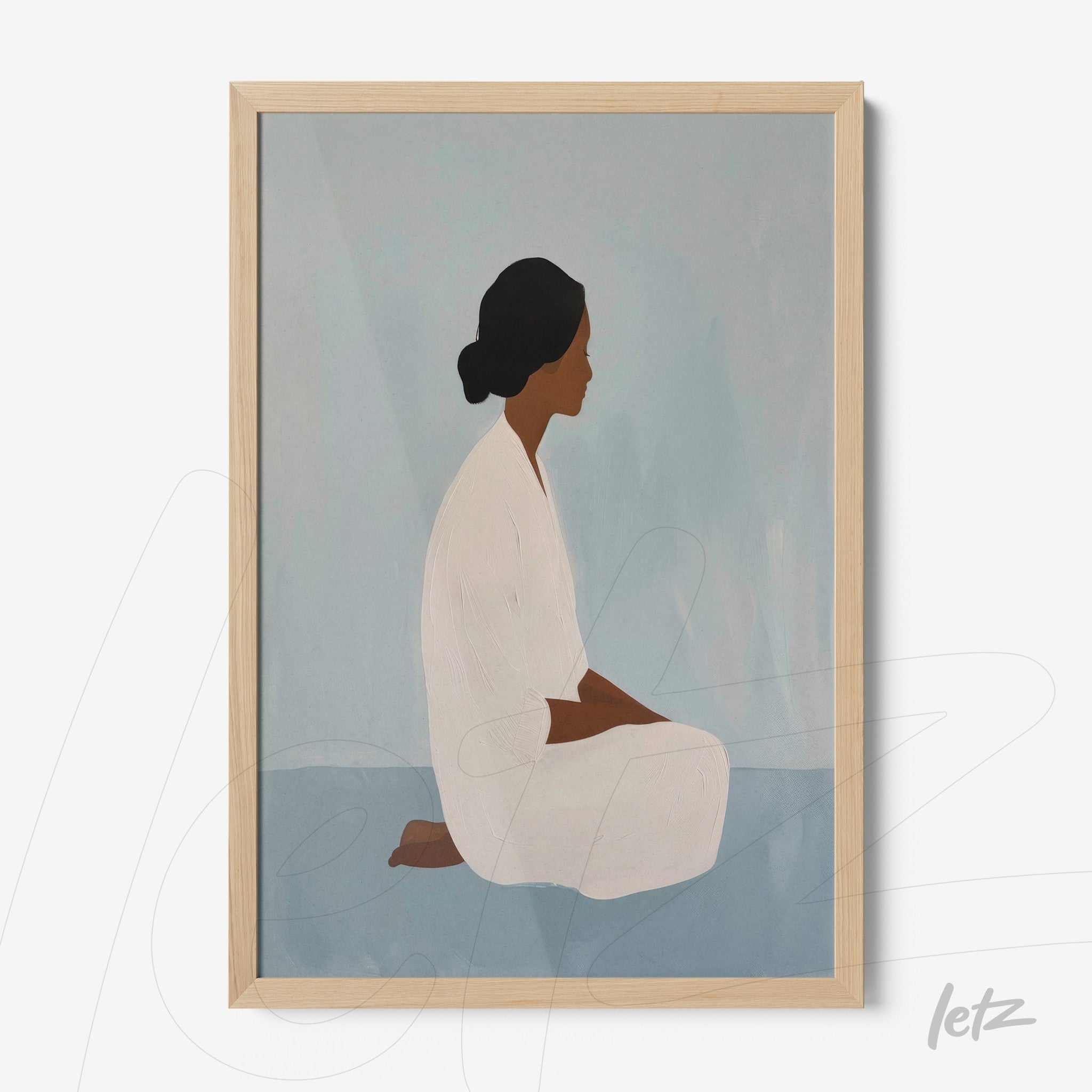 framed artwork featuring a soft-toned illustration of a woman sitting in profile with a light wood frame
