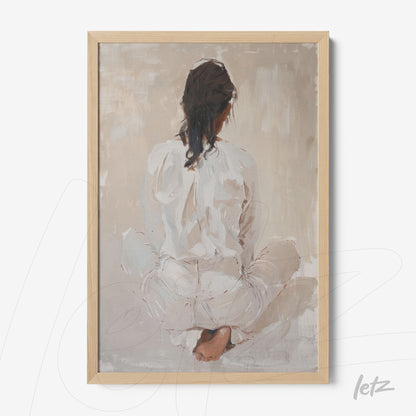 framed minimalist art of a woman sitting with her back to the viewer in neutral tones