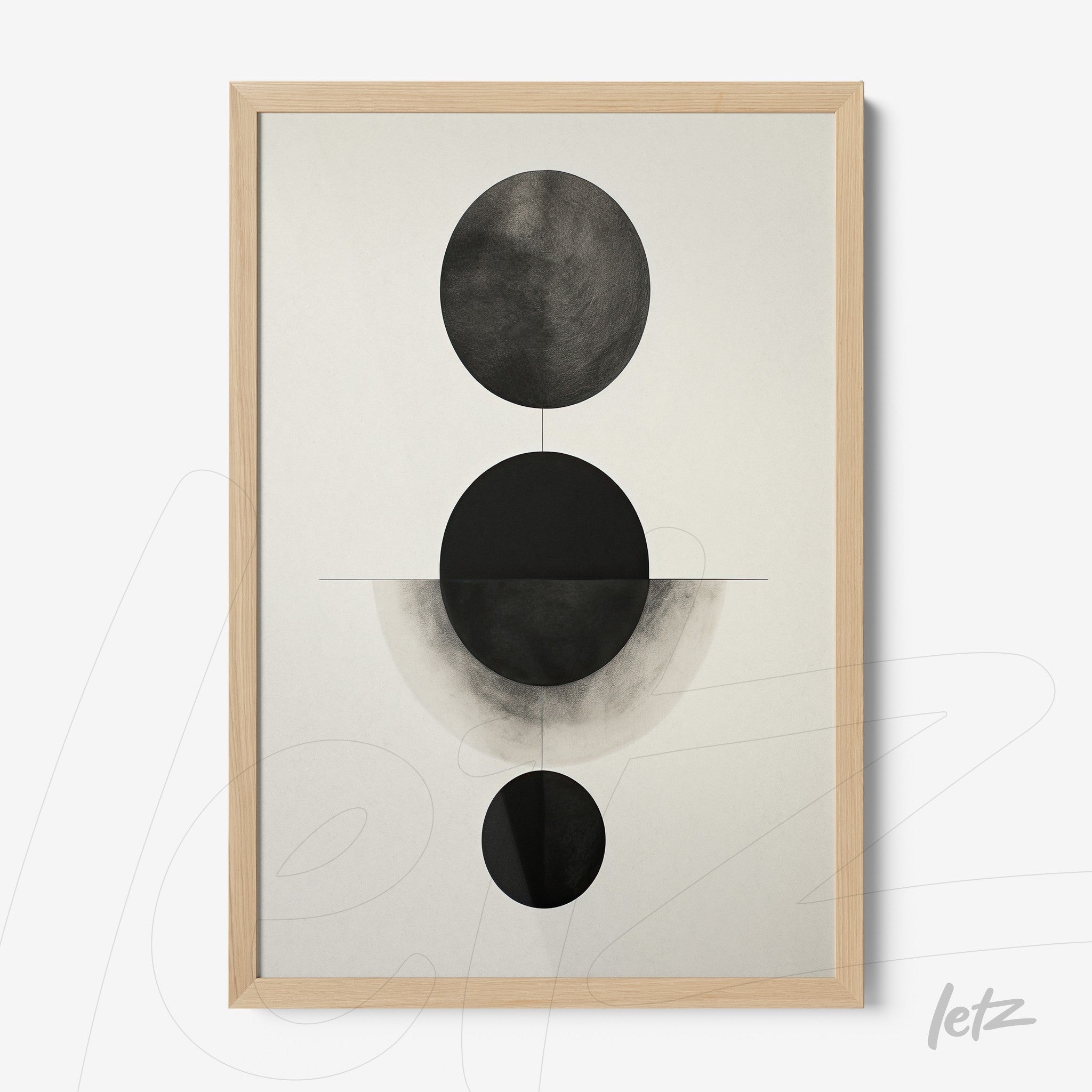 framed abstract artwork in black and white featuring circular shapes on a light background with a light wood frame