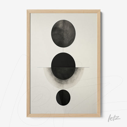 framed abstract artwork in black and white featuring circular shapes on a light background with a light wood frame