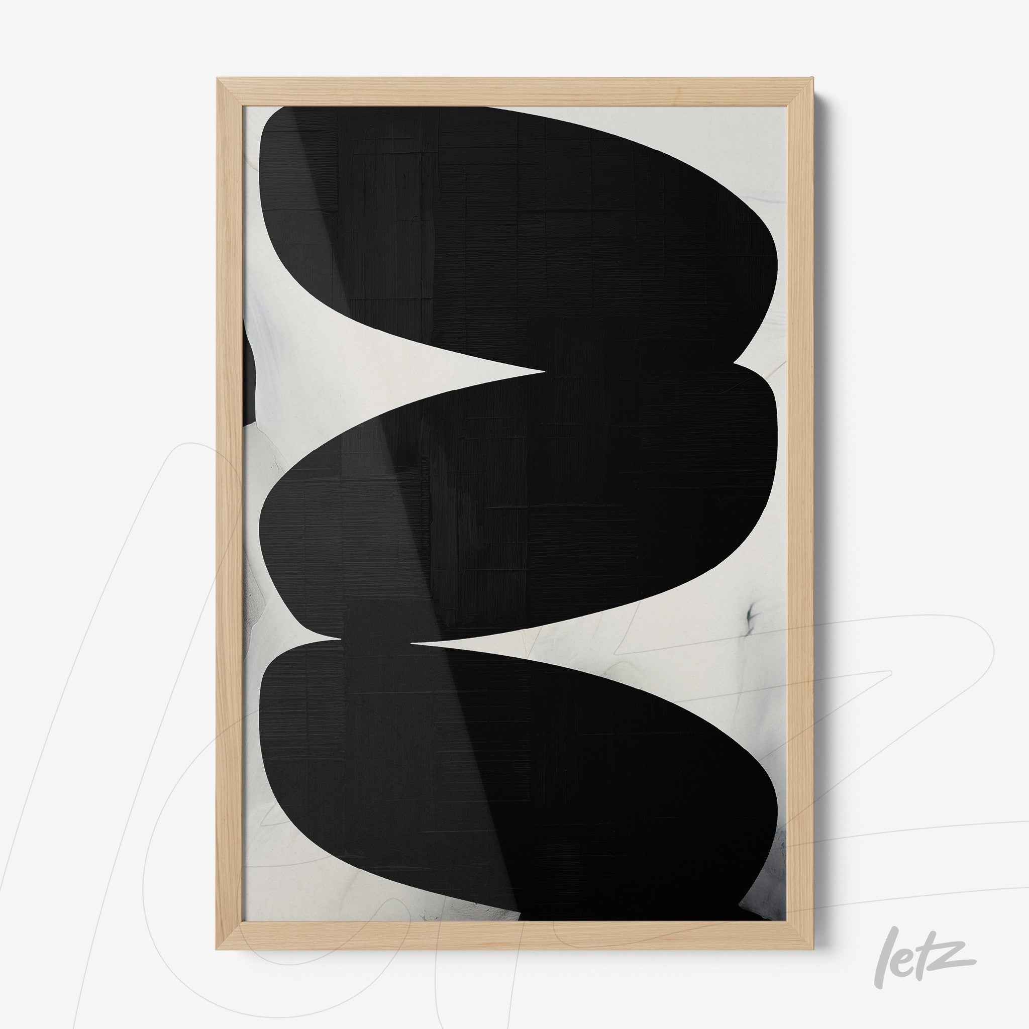 abstract wall art in black tones featuring curved shapes in light wood frame
