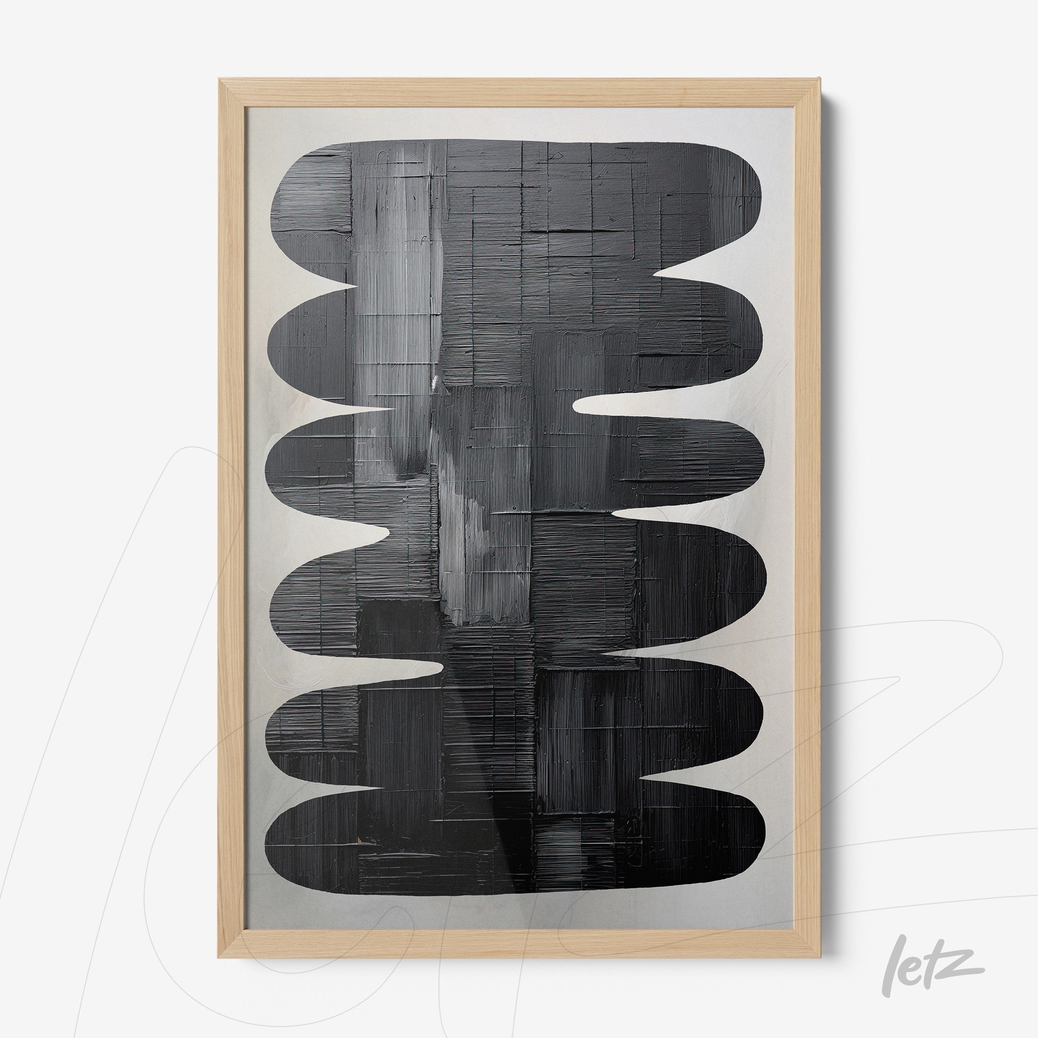 modern framed wall art featuring abstract black and white design with light wood frame